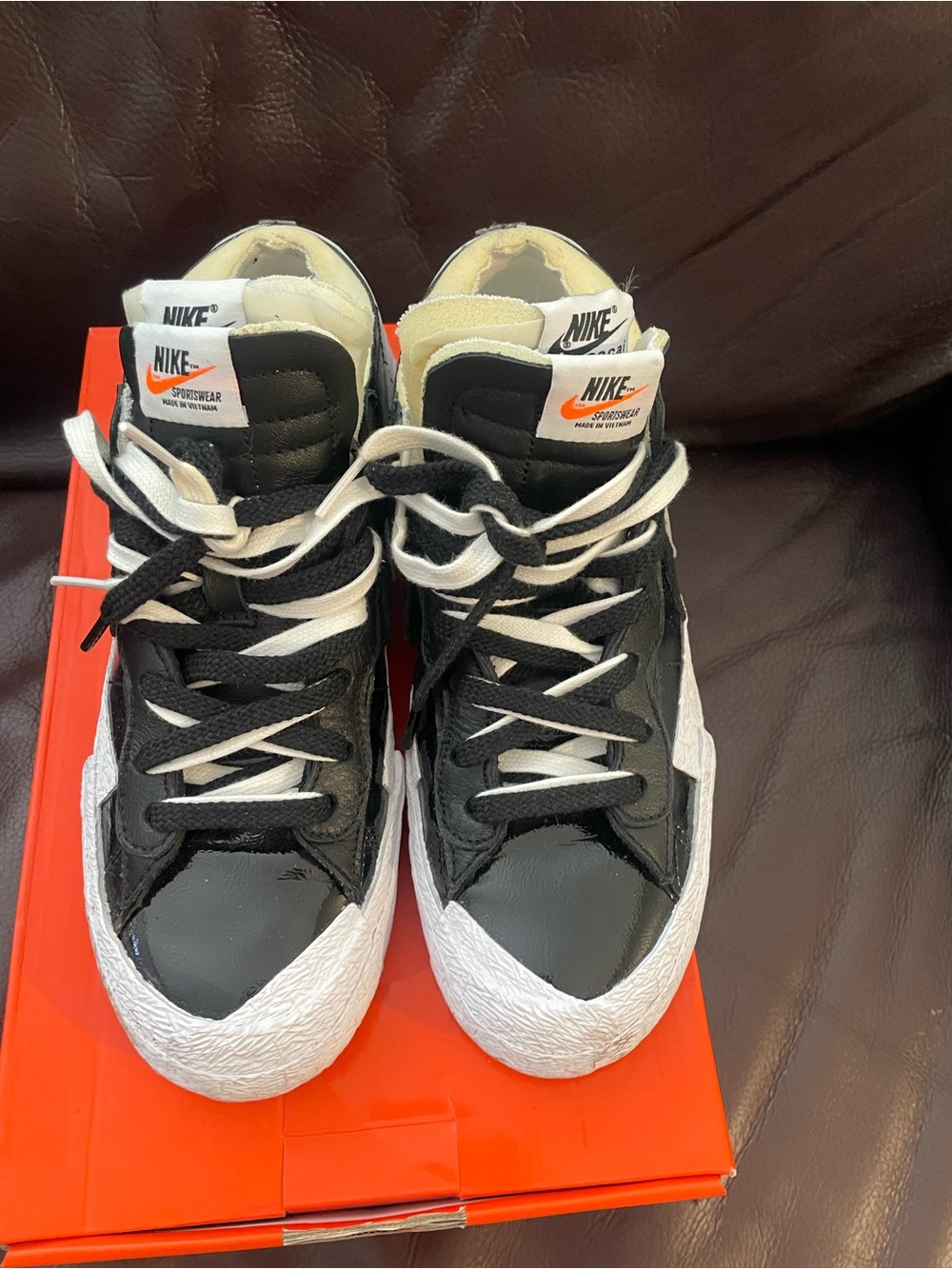Nike x sacai Blazer Low Black Patent Leather sneakers.